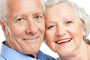 Close up headshot of man and woman smiling